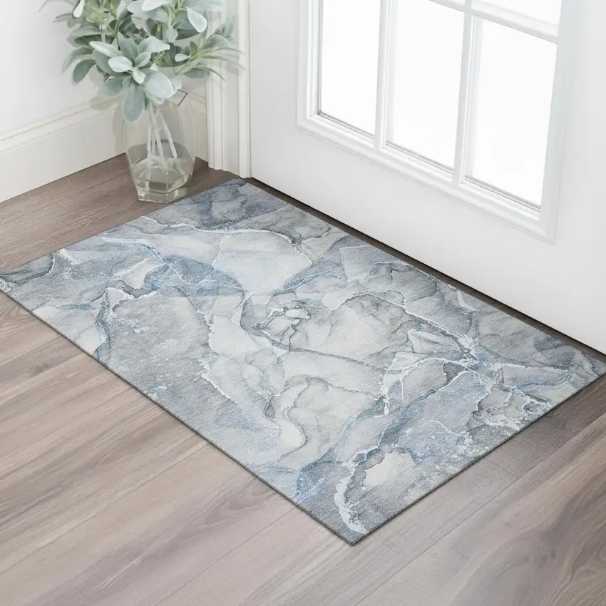 Blue And Ivory Abstract Washable Area Rug With UV Protection Photo 1