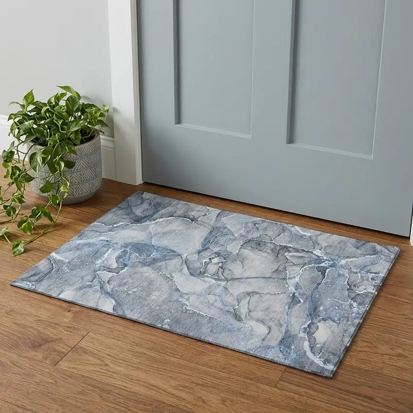 Blue And Ivory Abstract Washable Area Rug With UV Protection Photo 1