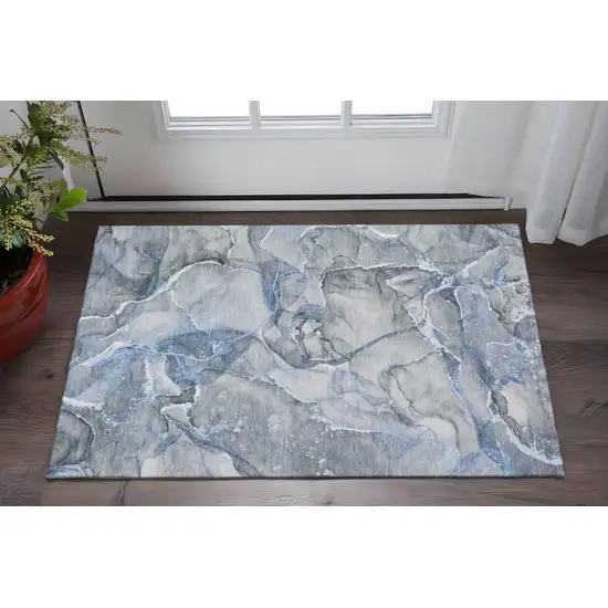Blue And Ivory Abstract Washable Area Rug With UV Protection Photo 2