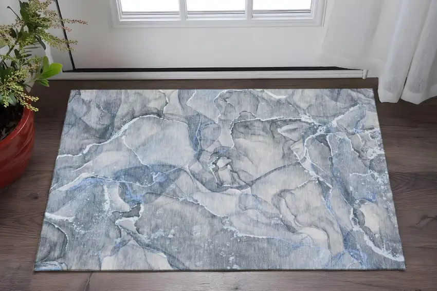 Blue And Ivory Abstract Washable Area Rug With UV Protection Photo 2