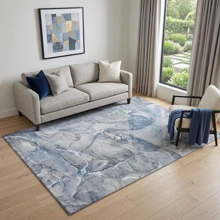Blue And Ivory Abstract Washable Area Rug With UV Protection Photo 1