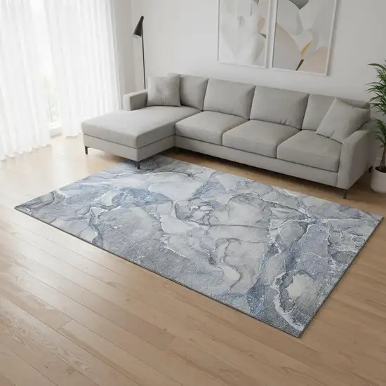 Blue And Ivory Abstract Washable Area Rug With UV Protection Photo 1