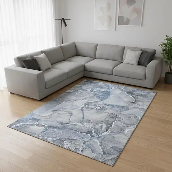Blue And Ivory Abstract Washable Area Rug With UV Protection Photo 1