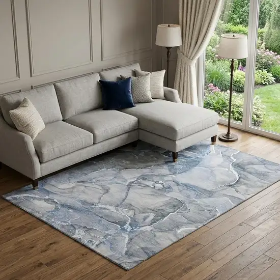 Blue And Ivory Abstract Washable Area Rug With UV Protection Photo 1