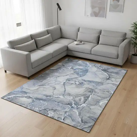 Blue And Ivory Abstract Washable Area Rug With UV Protection Photo 1