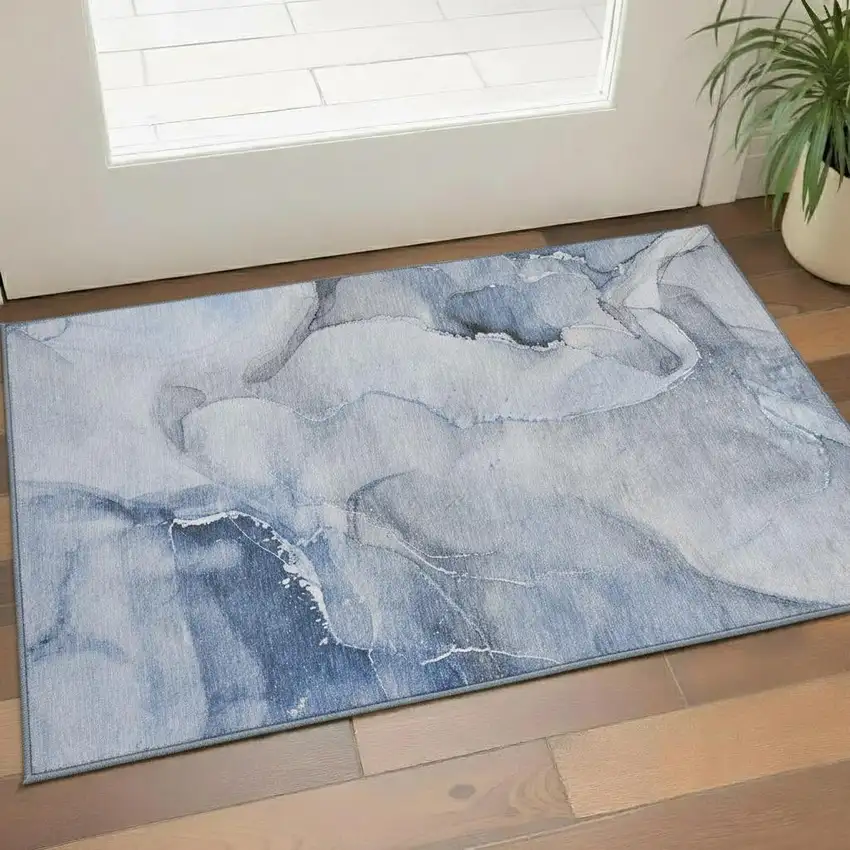 Blue And Ivory Abstract Washable Area Rug With UV Protection Photo 1