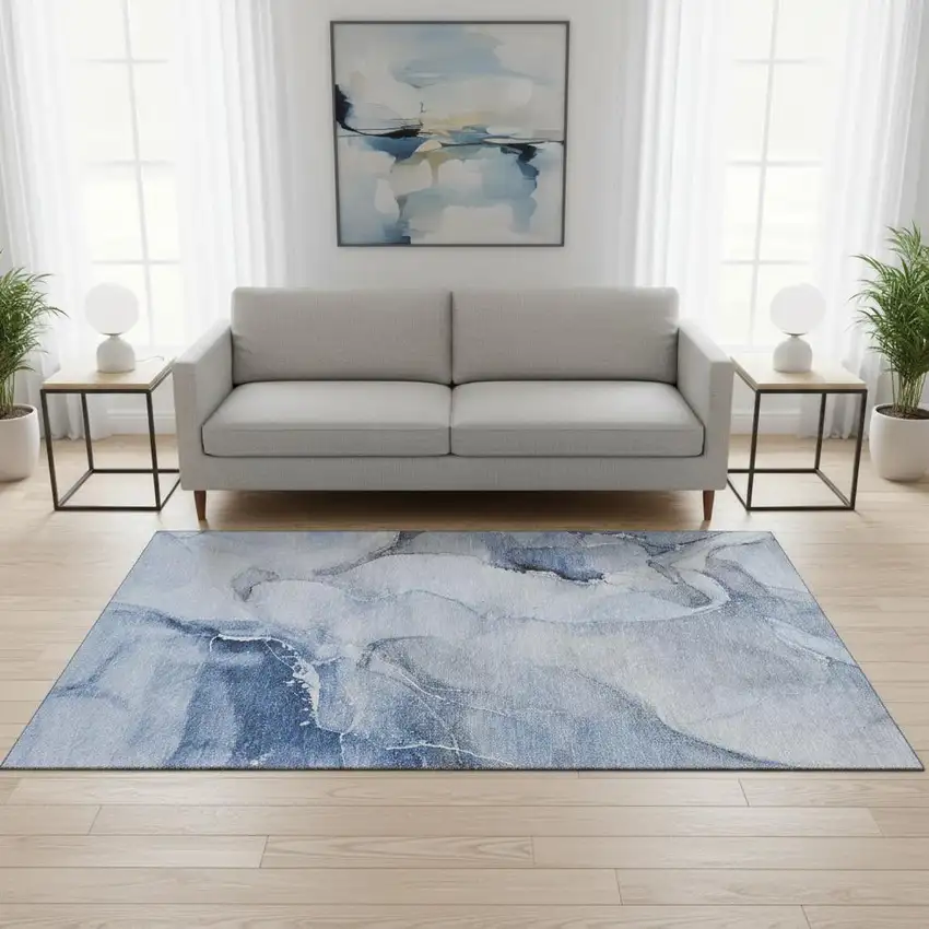 Blue And Ivory Abstract Washable Area Rug With UV Protection Photo 1