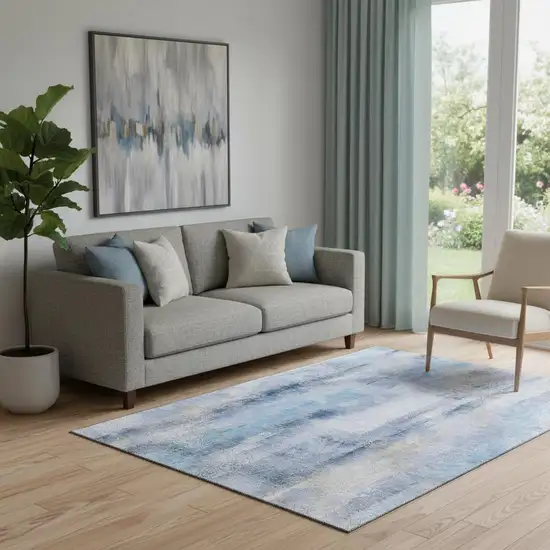 Blue And Ivory Abstract Washable Area Rug With UV Protection Photo 1