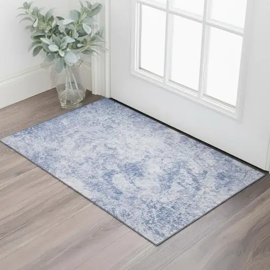 Blue And Ivory Abstract Washable Area Rug With UV Protection Photo 1