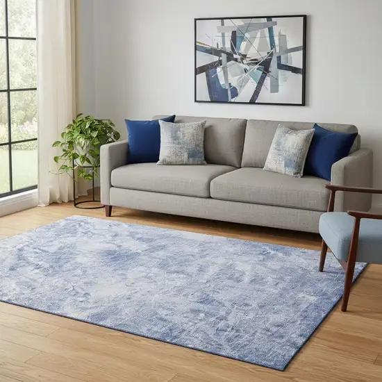Blue And Ivory Abstract Washable Area Rug With UV Protection Photo 1