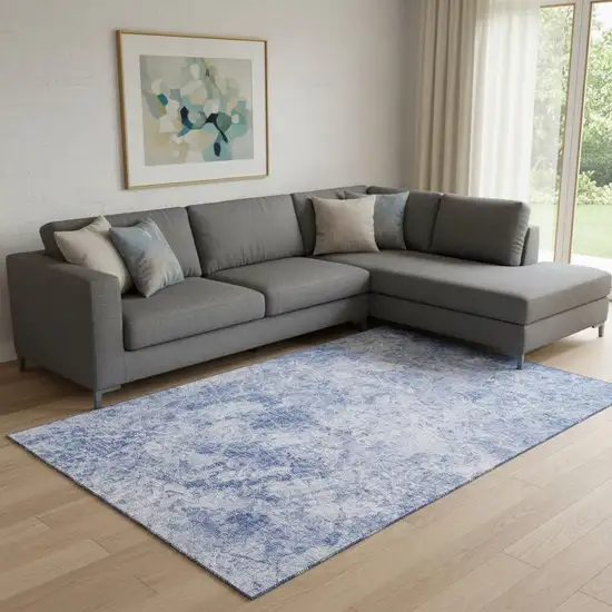 Blue And Ivory Abstract Washable Area Rug With UV Protection Photo 1