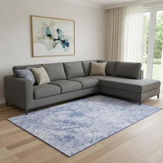 Blue And Ivory Abstract Washable Area Rug With UV Protection Photo 1