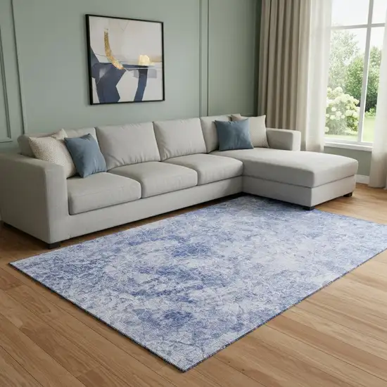 Blue And Ivory Abstract Washable Area Rug With UV Protection Photo 1
