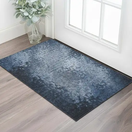 Blue And Ivory Abstract Washable Area Rug With UV Protection Photo 1