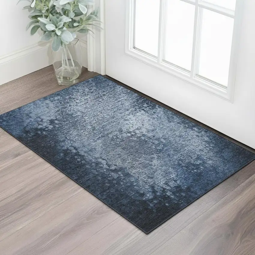Blue And Ivory Abstract Washable Area Rug With UV Protection Photo 1