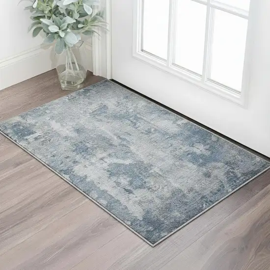 Blue And Ivory Abstract Washable Area Rug With UV Protection Photo 2