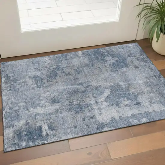 Blue And Ivory Abstract Washable Area Rug With UV Protection Photo 1