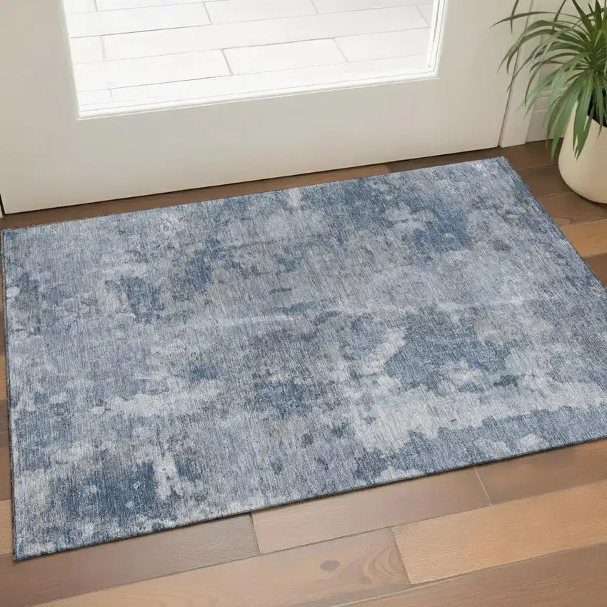 Blue And Ivory Abstract Washable Area Rug With UV Protection Photo 1