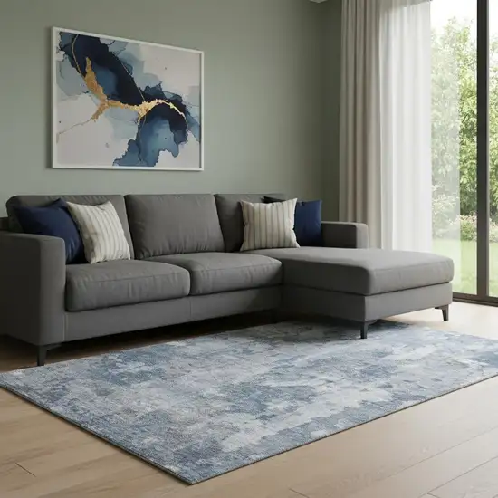 Blue And Ivory Abstract Washable Area Rug With UV Protection Photo 1