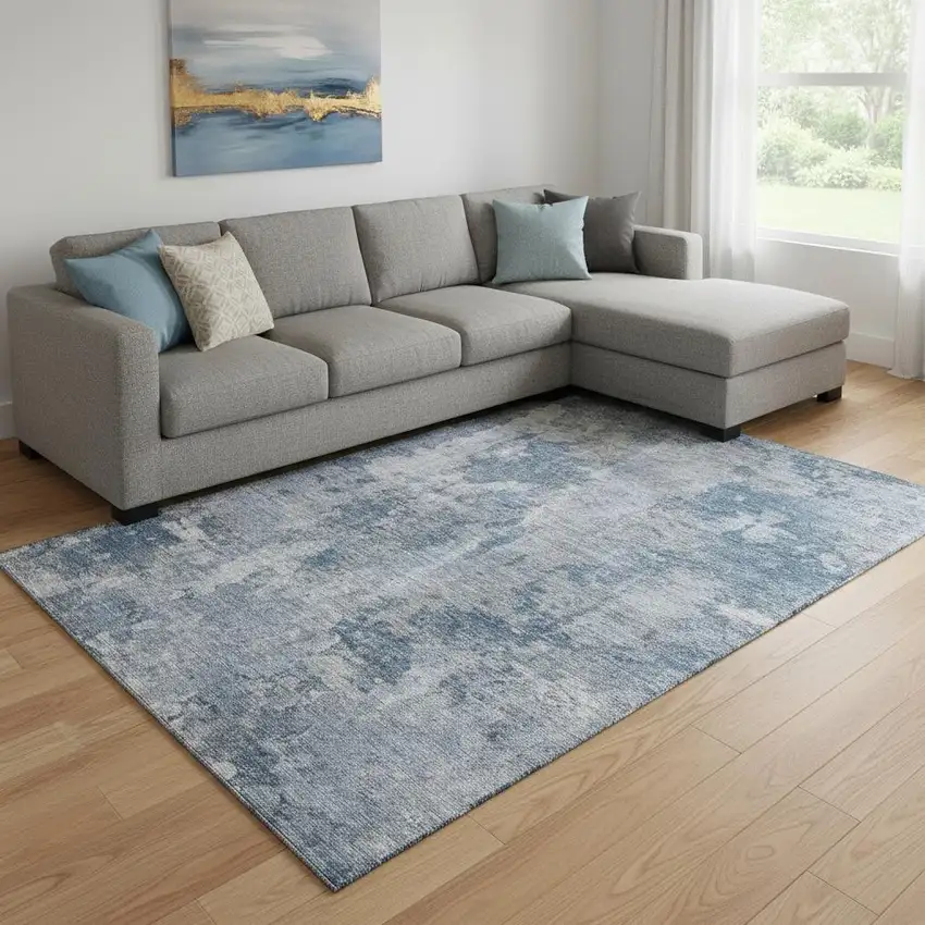 Blue And Ivory Abstract Washable Area Rug With UV Protection Photo 1