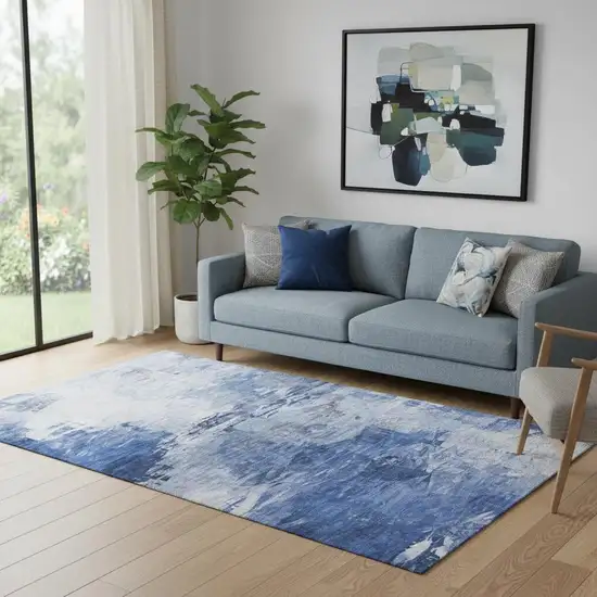 Blue And Ivory Abstract Washable Area Rug With UV Protection Photo 1