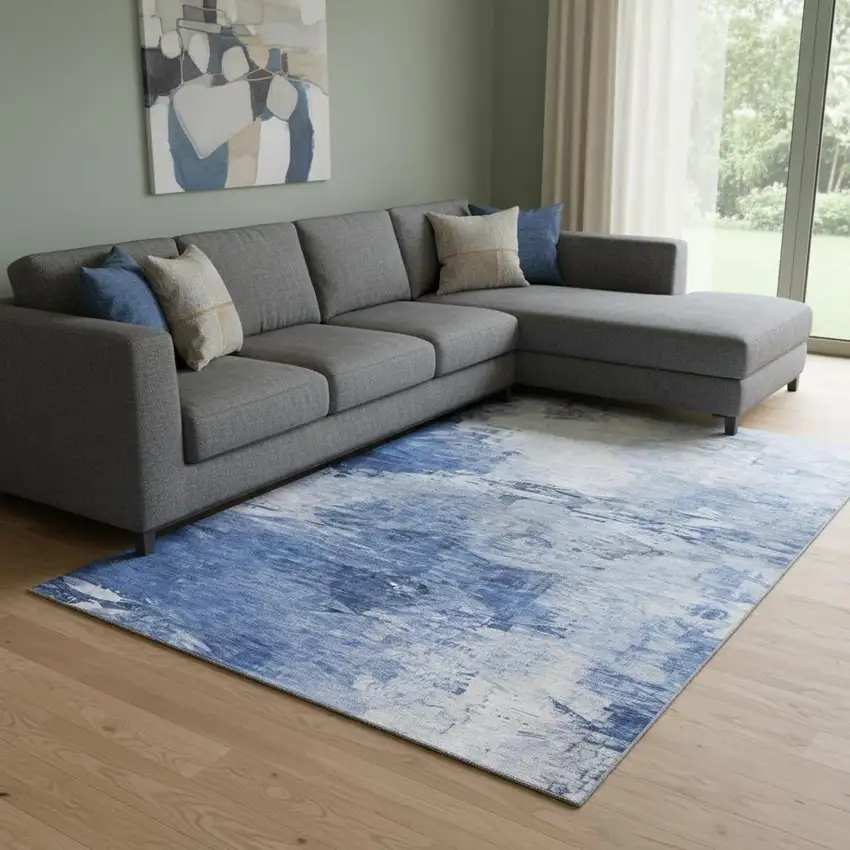 Blue And Ivory Abstract Washable Area Rug With UV Protection Photo 1