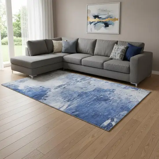 Blue And Ivory Abstract Washable Area Rug With UV Protection Photo 1
