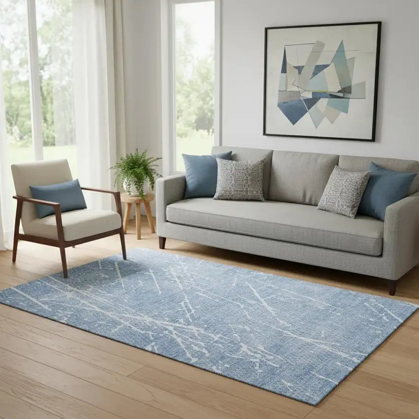 Blue And Ivory Abstract Washable Area Rug With UV Protection Photo 1