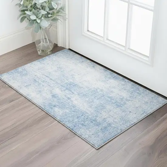 Blue And Ivory Abstract Washable Area Rug With UV Protection Photo 2