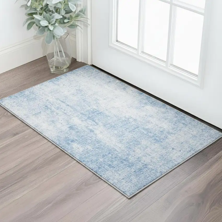 Blue And Ivory Abstract Washable Area Rug With UV Protection Photo 2