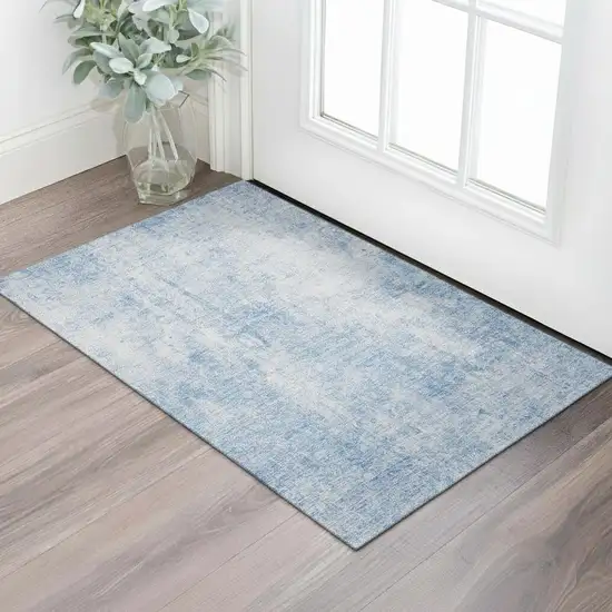 Blue And Ivory Abstract Washable Area Rug With UV Protection Photo 1