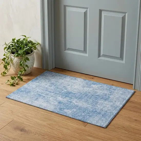 Blue And Ivory Abstract Washable Area Rug With UV Protection Photo 1