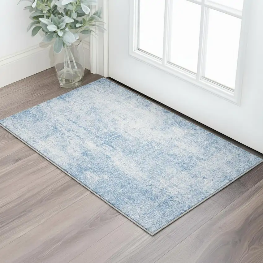 Blue And Ivory Abstract Washable Area Rug With UV Protection Photo 3