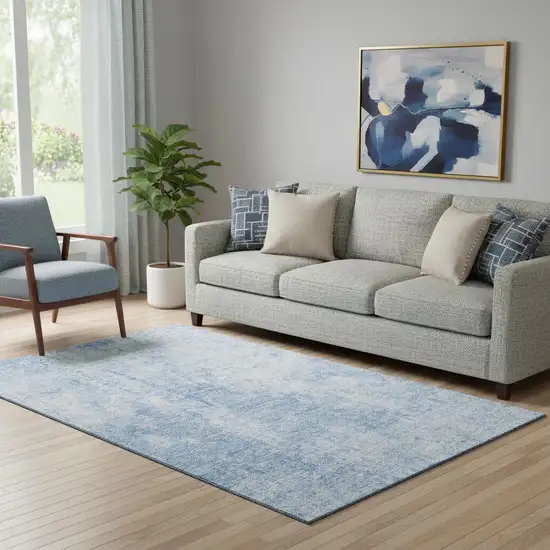 Blue And Ivory Abstract Washable Area Rug With UV Protection Photo 1