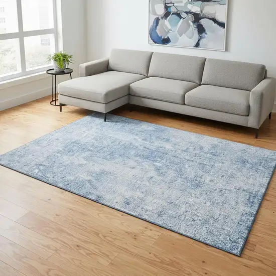 Blue And Ivory Abstract Washable Area Rug With UV Protection Photo 1