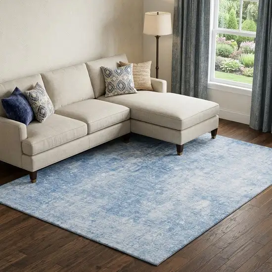 Blue And Ivory Abstract Washable Area Rug With UV Protection Photo 1