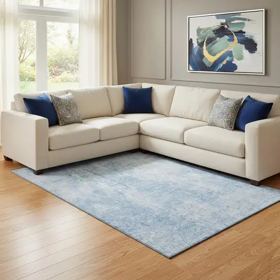 Blue And Ivory Abstract Washable Area Rug With UV Protection Photo 1