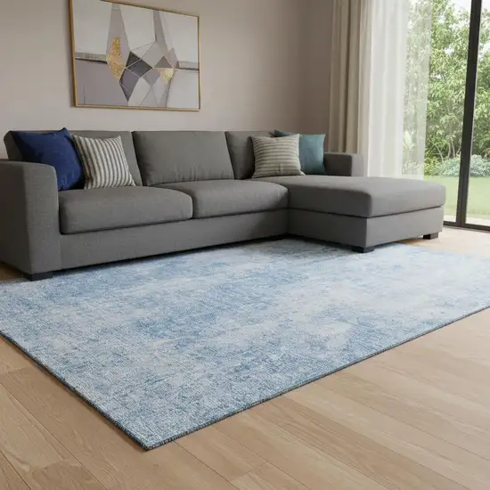 Blue And Ivory Abstract Washable Area Rug With UV Protection Photo 1