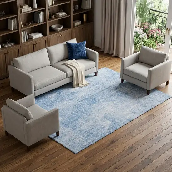 Blue And Ivory Abstract Washable Area Rug With UV Protection Photo 1