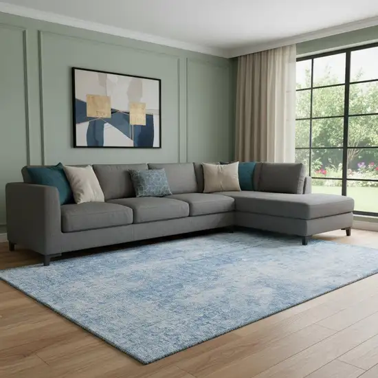 Blue And Ivory Abstract Washable Area Rug With UV Protection Photo 1