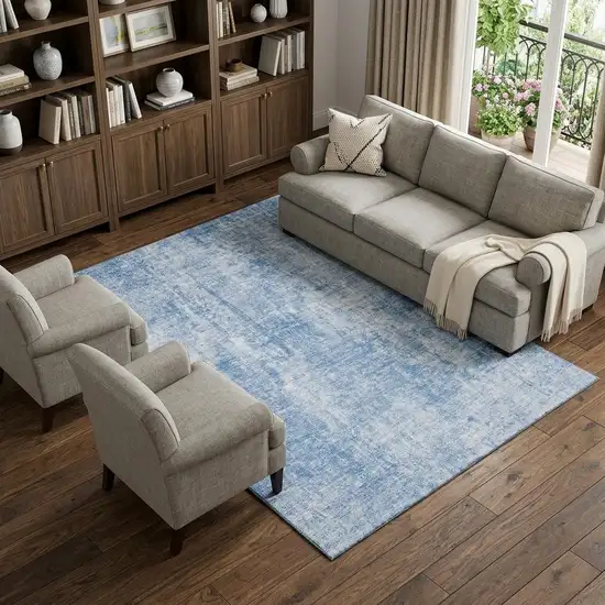 Blue And Ivory Abstract Washable Area Rug With UV Protection Photo 1