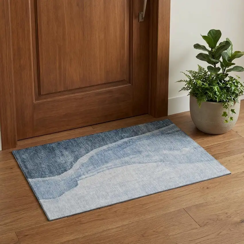 Blue And Ivory Abstract Washable Area Rug With UV Protection Photo 1