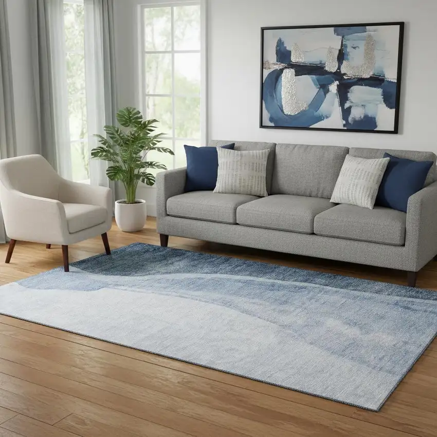 Blue And Ivory Abstract Washable Area Rug With UV Protection Photo 1
