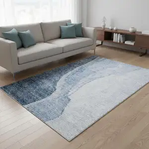 Photo of Blue And Ivory Abstract Washable Area Rug With UV Protection