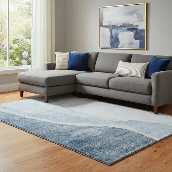 Blue And Ivory Abstract Washable Area Rug With UV Protection Photo 1