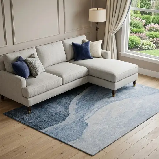 Blue And Ivory Abstract Washable Area Rug With UV Protection Photo 1
