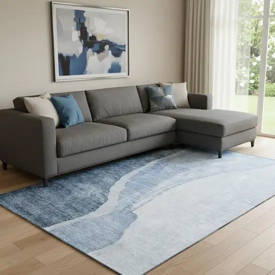 Blue And Ivory Abstract Washable Area Rug With UV Protection Photo 1
