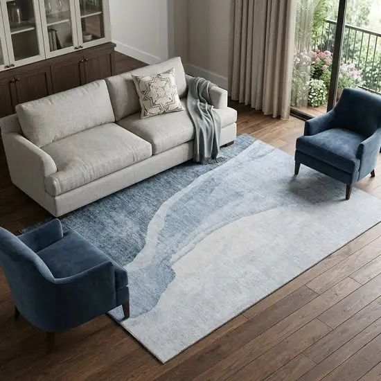 Blue And Ivory Abstract Washable Area Rug With UV Protection Photo 1