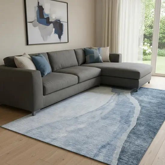 Blue And Ivory Abstract Washable Area Rug With UV Protection Photo 1
