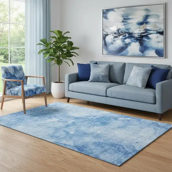 Blue And Ivory Abstract Washable Area Rug With UV Protection Photo 1